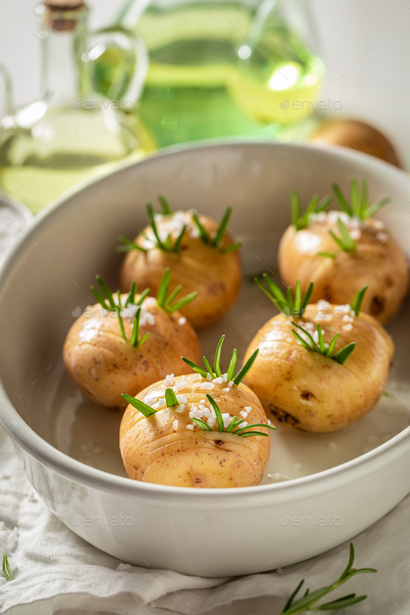 Tasty baked potatoes with fresh herbs and salt. Swedish cuisine.