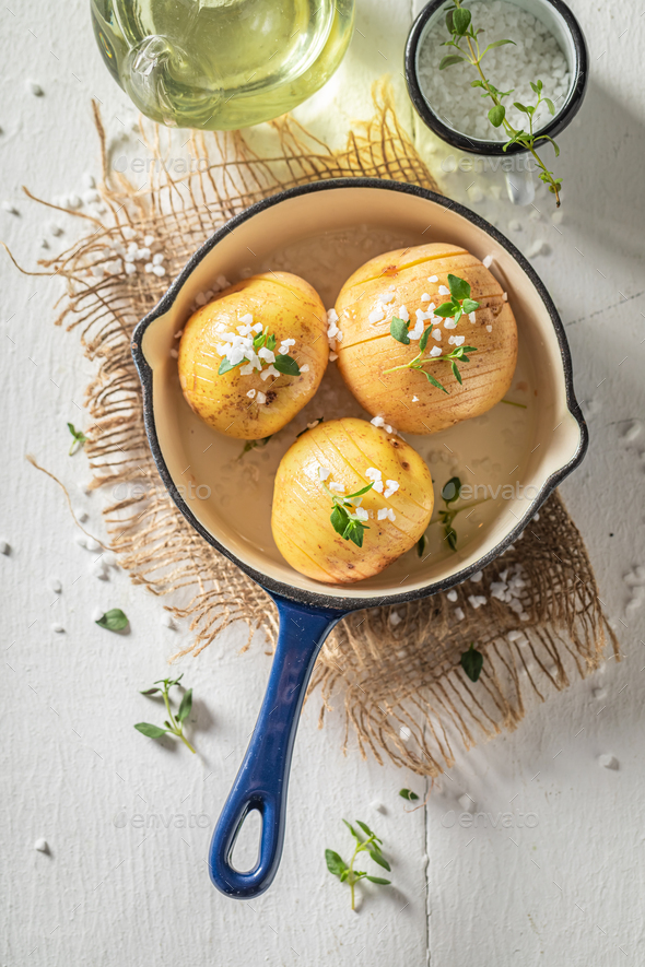 Tasty baked potatoes with herbs and oil. Swedish cuisine.