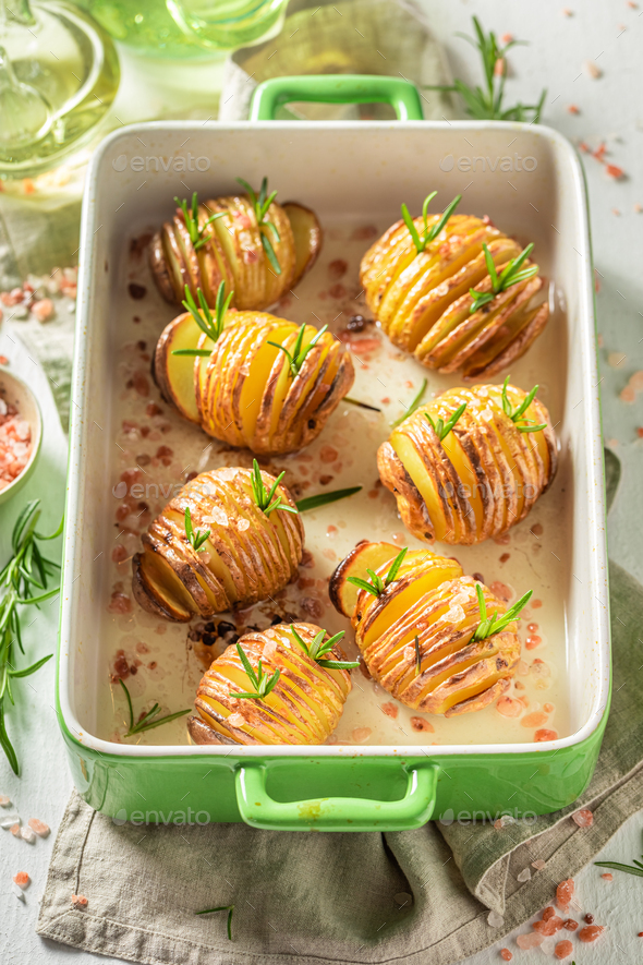 Homemade baked potatoes with fresh herbs and salt. Swedish cuisine.