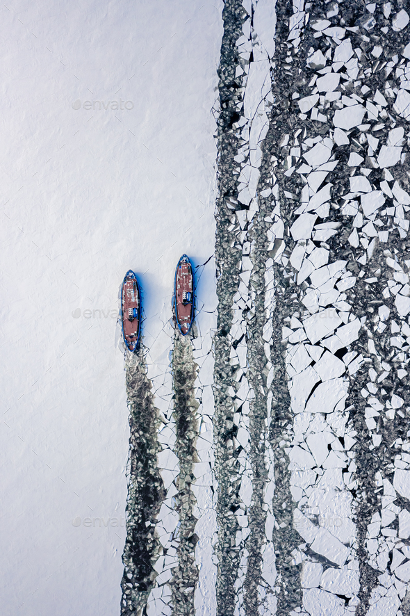Icebreakers on Vistula river near Plock breaking the ice, Poland