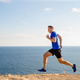 male runner run trail on seashore - PhotoDune Item for Sale