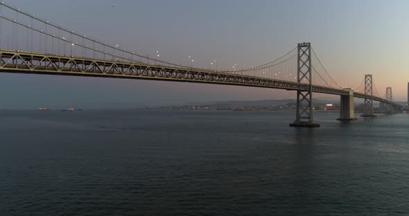 Pan Shot of the Oakland Bay Bridge and San Francisco Skyline at Dusk alt