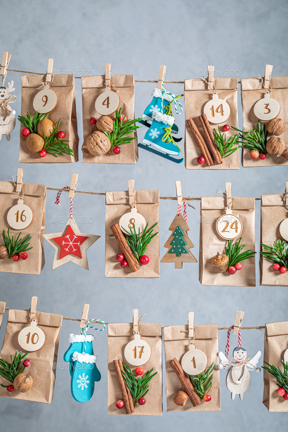 Handmade Advent Calendar for Christmas made of paper and string - Stock Photo - Images