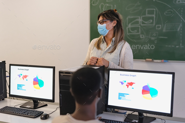 Hispanic professor teaching in high school while wearing face mask during corona virus pandemic