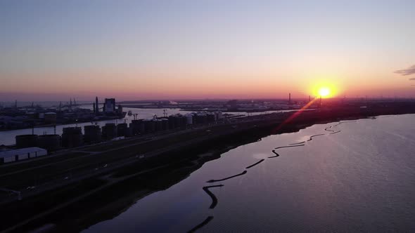 Light Traffic On The Highway Near Brielse Meer And Maasvlakte At Dusk. aerial alt
