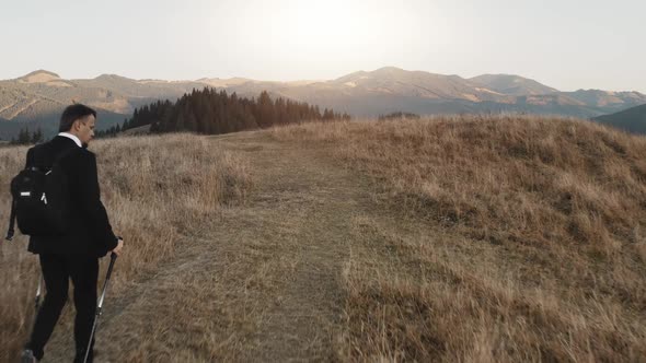 Businessman Tourist at Rural Mountain Road Aerial alt