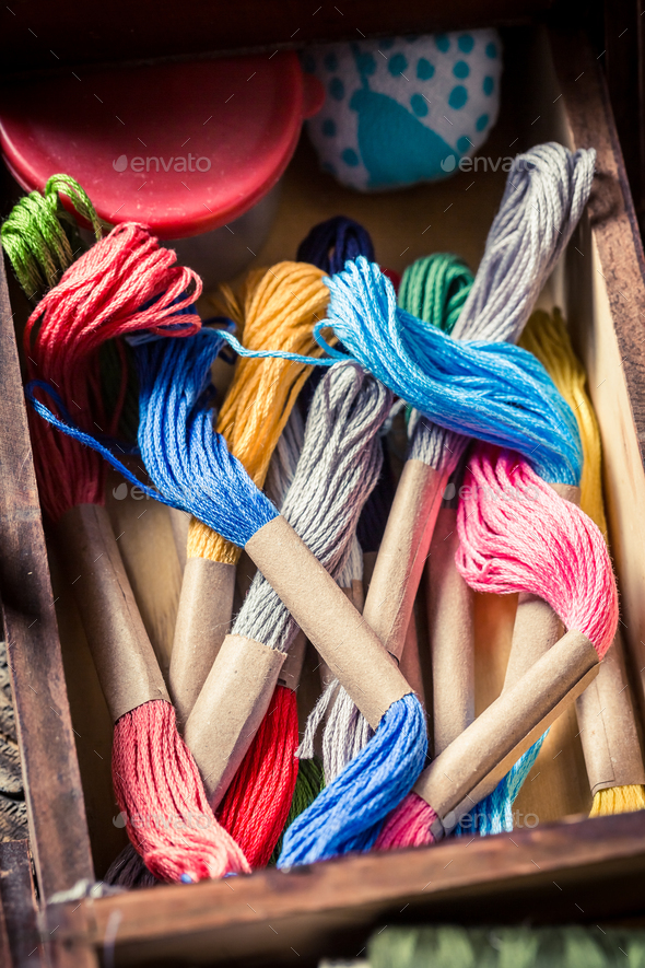 Vintage tailor's wooden box with buttons, threads and needles Stock