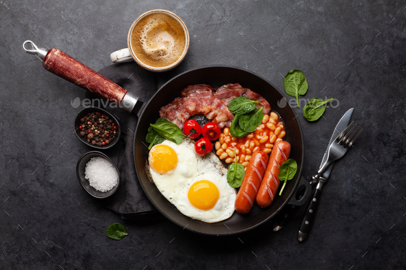 English breakfast with fried eggs, beans, bacon and sausages - Stock Photo - Images