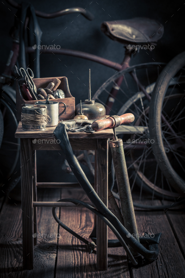 Old bike fix service with tools, wheels and tube