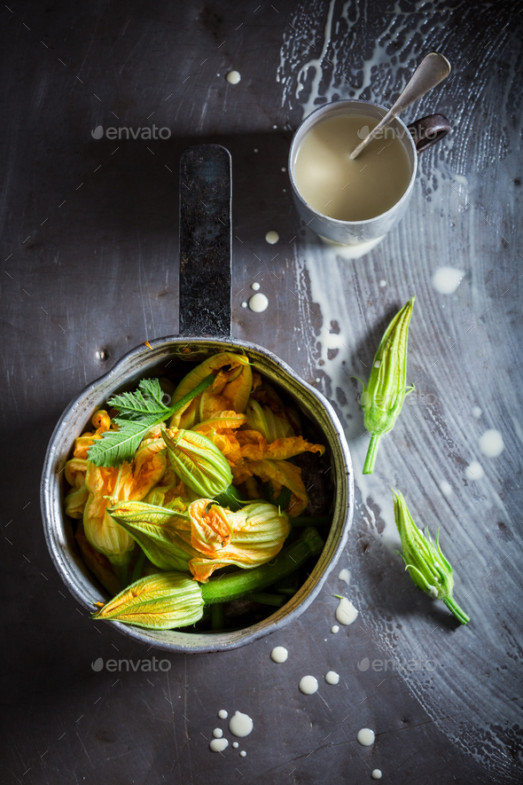 Ingredients for crispy fried zucchini flower made of pancake batter