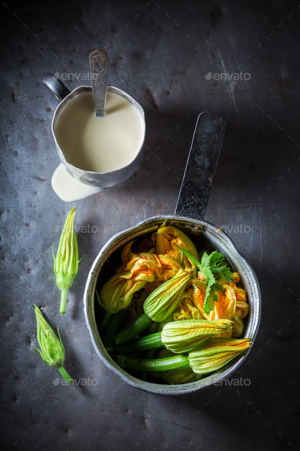 Preparation for roasted zucchini flower made of pancake batter Stock