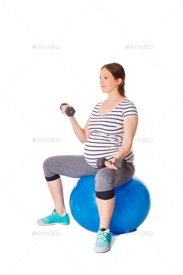 Pregnant woman doing exercises with exercise ball Stock Photo by Dmitry