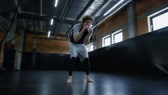 Progressive Sportsman Warming Up in Sport Club. Sportsman Warming Up Gym alt