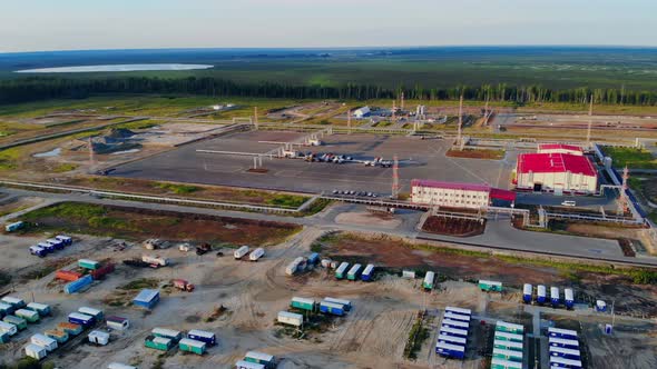 The Drone Flies Over Temporary Housing for Workers in Mobile Homes and a Parking Lot for Heavy