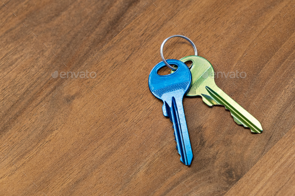 keys on wooden table background. rent sell buy apartment estate business