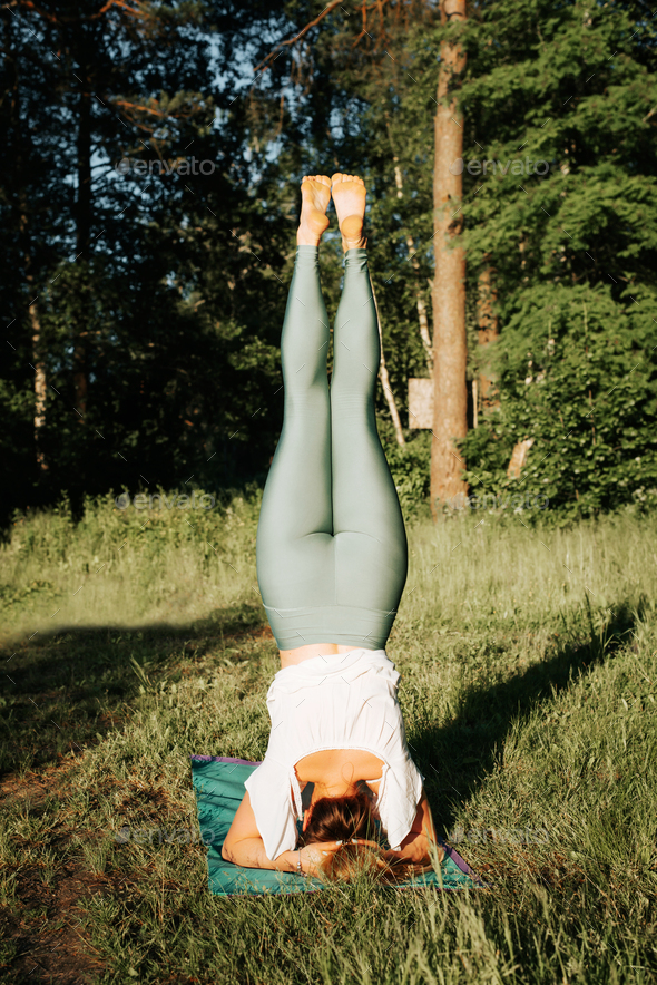 Girl Doing Yoga Poseshirshasana Or Yoga Headstand Is An Asana In