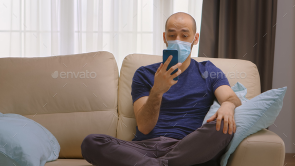 Man with protection mask on a video call