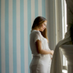 Pregnant woman wearing lingerie and posing in the room Stock Photo by  BGStock72