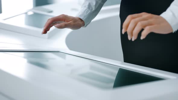 Closeup of Hands Touching Modern Screen in the Hitech Office or Software Lab alt
