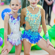 Little gymnasts with medals in rhythmic gymnastics competition