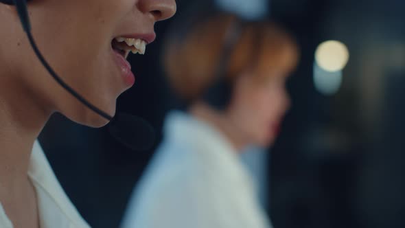 Asia young call center team or customer support service executive using computer and microphone. alt