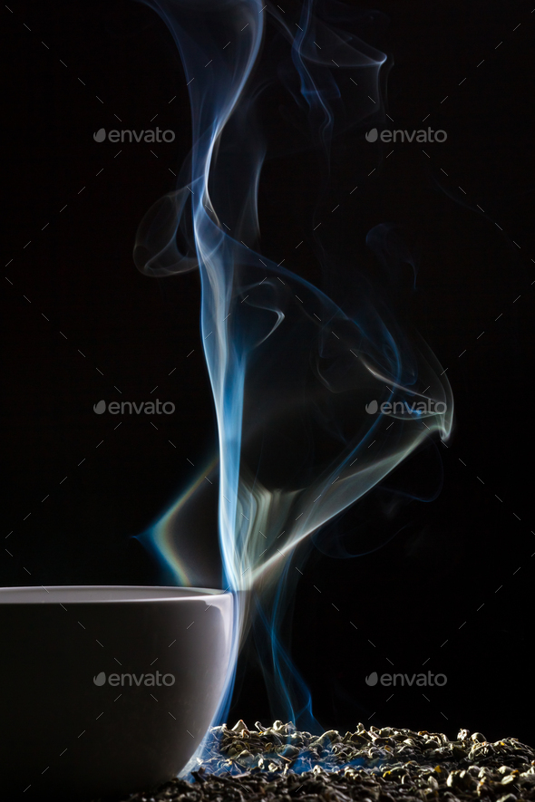 Smoke and cup with grain of tea