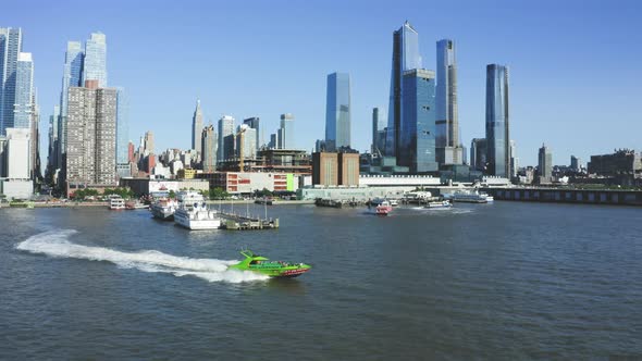 Aerial Tracking Shot of Power Boat on the Hudson River in New York City