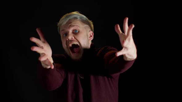 Overjoyed Young Man Wins Competition Achieves Goal and Makes Triumph Gesture Says Yes Shows Fist alt