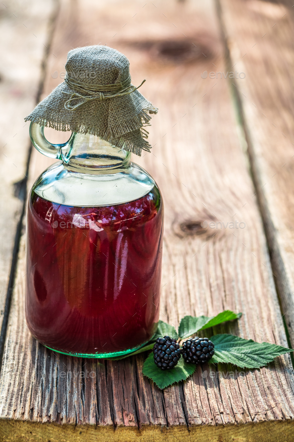 Healing tincture as natural medicine made of blackberries Stock Photo