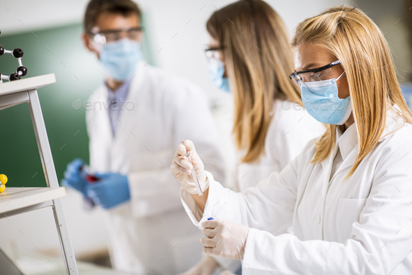 Doctors wearing protective  face mask and safety googles - Stock Photo - Images
