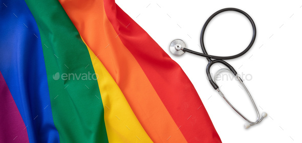 LGBT Health care. Medical Stethoscope on rainbow pride flag, white background, overhead view