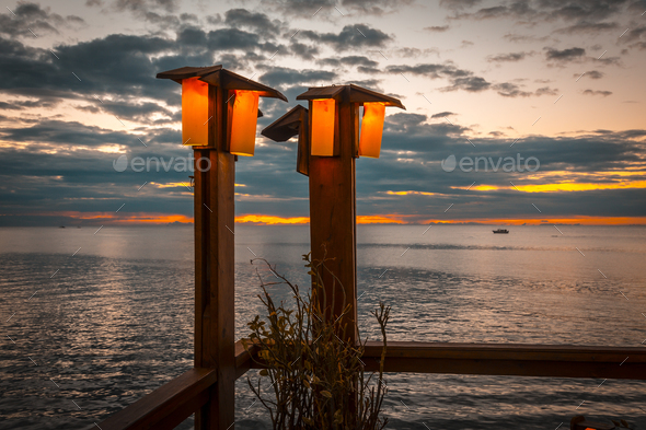 Lampposts of a restaurant in the sunset of West End on Roatan Island