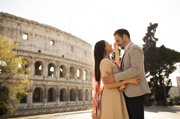 Loving Couple In Front Of The Colosseum In Rome Stock Photo By BGStock72