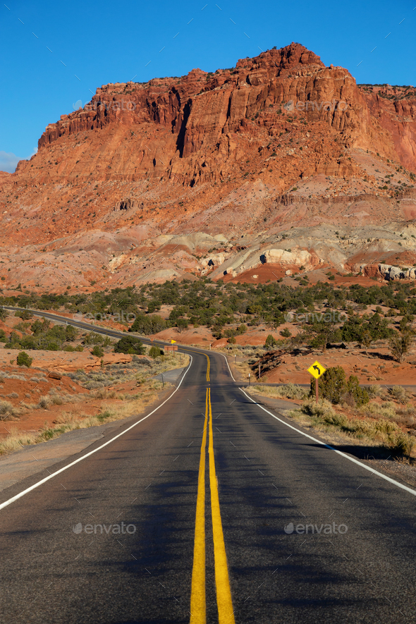 Scenic road in the desert during a vibrant sunny sunrise Stock Photo by ...