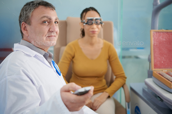 Doctor Pointing At Ophthalmology Chart