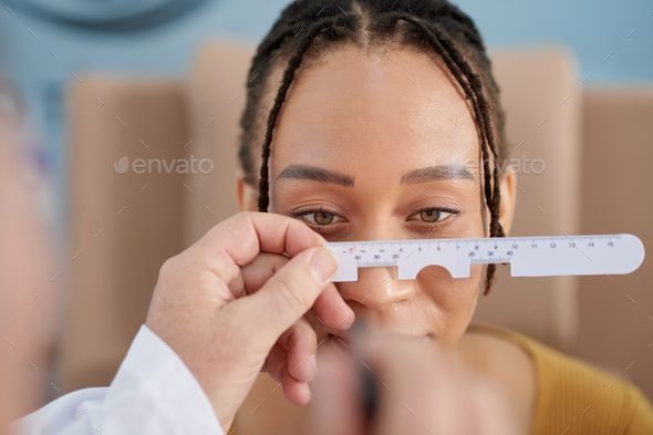Doctor Measuring Distance Between Eyes - Stock Photo - Images