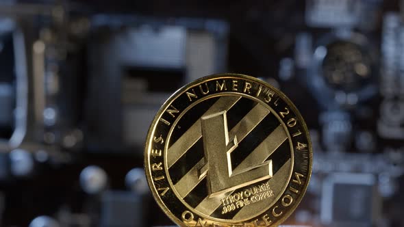 Litecoin Spinning on Computer Motherboard Background Cryptocurrency Mining Virtual Money alt