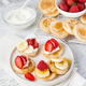 Mini pancake cereal with banana, raspberry, strawberry, honey, yogurt for breakfast. - PhotoDune Item for Sale