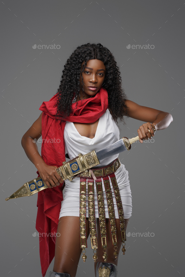 Ancient female roman soldier with gladius and red cape - Stock Photo - Images