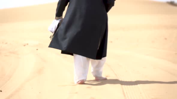 Groom Walking in the Desert