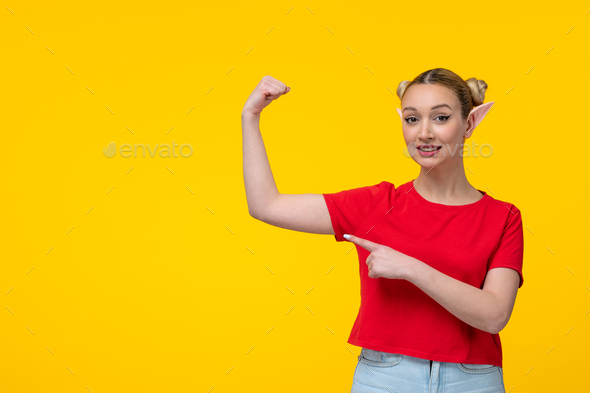 young female with elf ears showing her strong arms yellow background girl cartoon