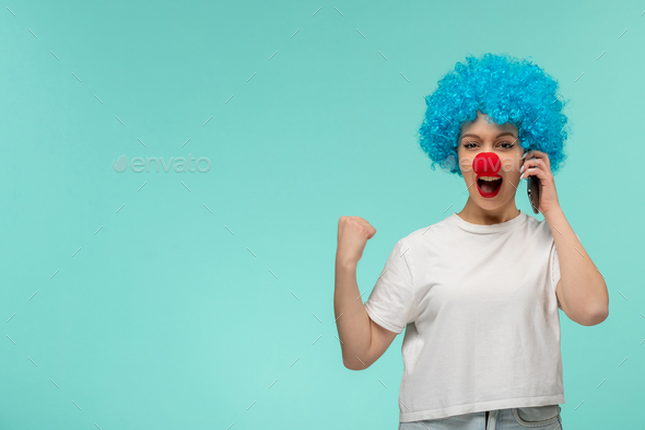 april fools day happy girl fist sign yes I did it with red nose clown costume blue hair