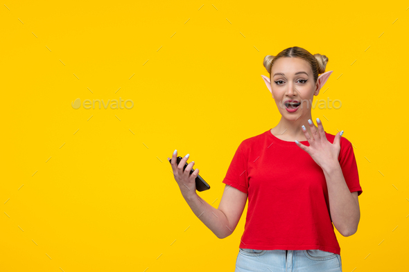 caucasian female with elf ears using her phone yellow background girl cartoon