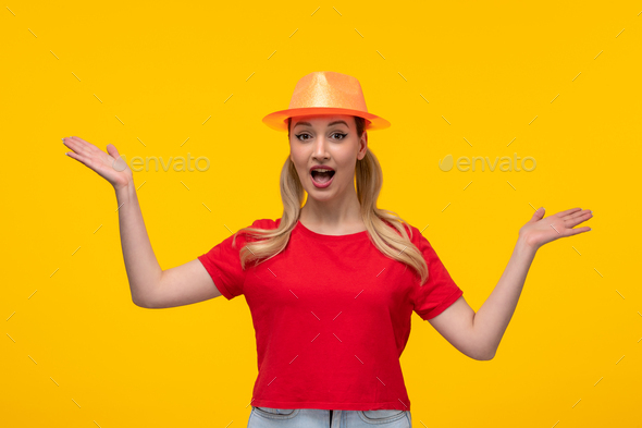 young female model in red t-shirt with orange hat yellow background cartoon girl