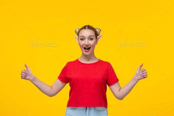 excited young female in red t-shirt with elf ears yellow background cartoon
