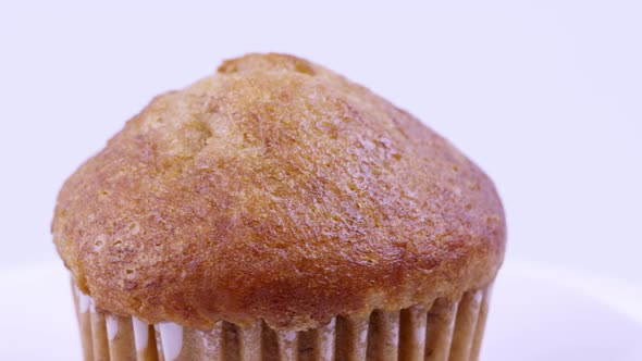 Muffins banana with white background shallow focus and slowly rotating. alt