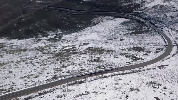 AERIALS of Snowy landscape in Lesotho, Africa - Snow fall in Africa Car driving on roads in snowy l alt