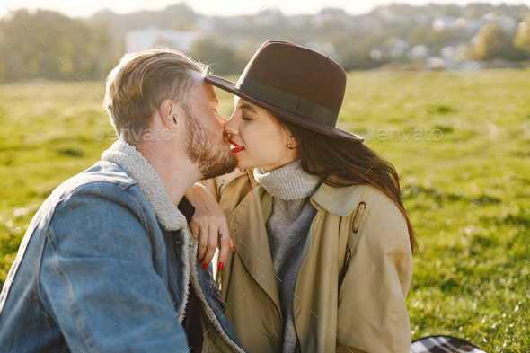 Stylish couple have a picnic on a nature and kissing - Stock Photo - Images