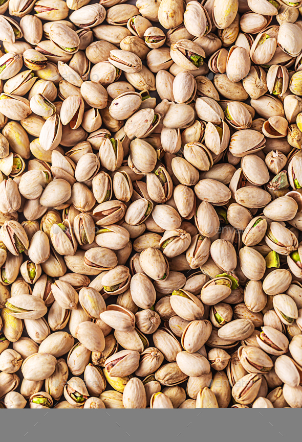 Pistachios seeds texture, top view, vertical. It has high levels of