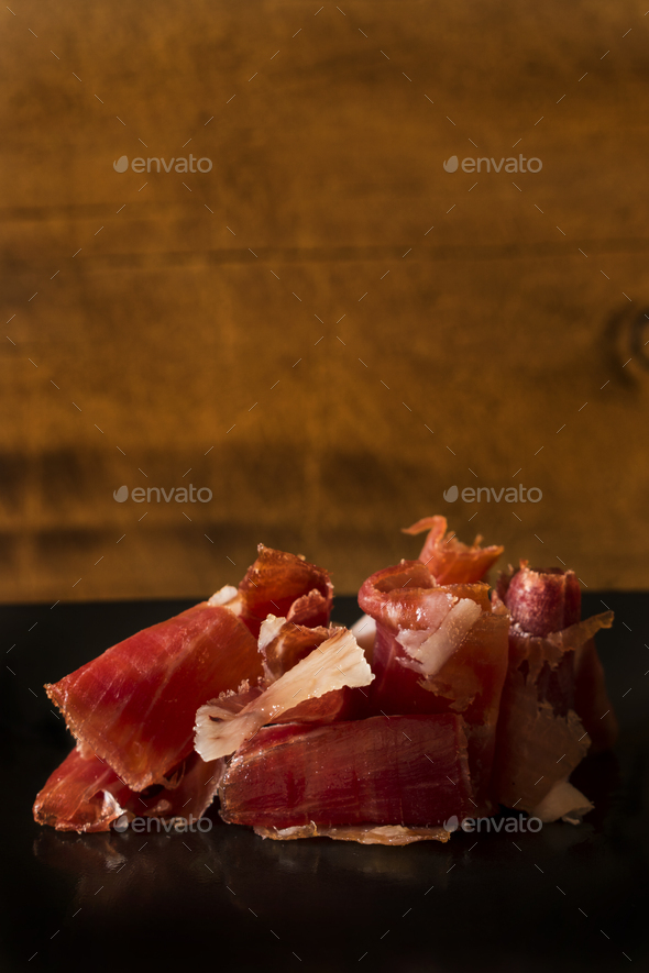 Serrano ham chips on a plate.